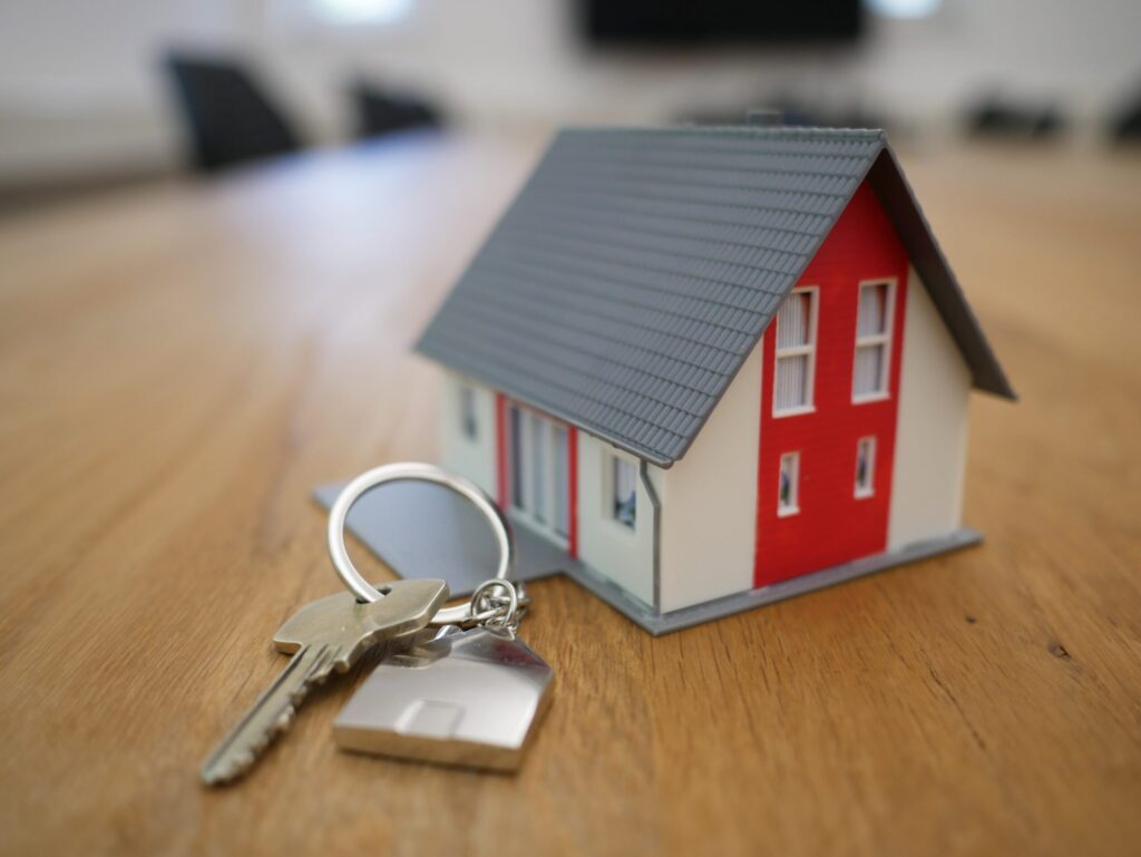 A small toy house with a set of keys